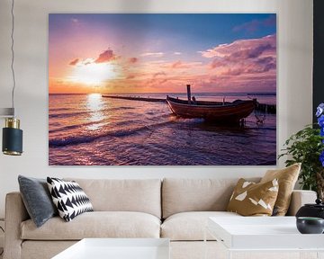Wooden fishing boat on the beach at dusk by Michel Lask