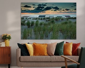 wooden beach huts along the coast by gaps photography