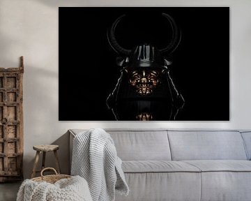 Antique samurai helmet with horns in dramatic light
