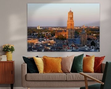 Cityscape of Utrecht with the Dom tower illuminated by the setting sun by Merijn van der Vliet