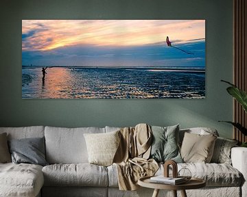 child flying a kite on the beach by Miny'S