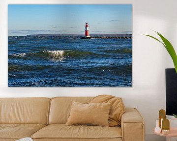 Waves and pier tower on the coast of the Baltic Sea in Warnemünde by Rico Ködder