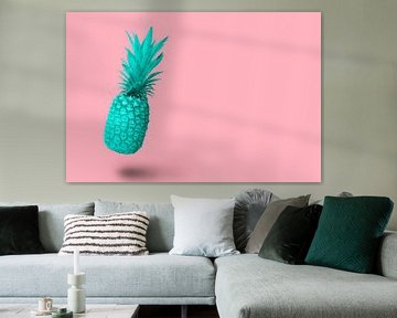 Design turquoise blue pineapple fruit floating on a pink backgro van Elles Rijsdijk