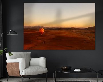 Hot air balloon floats over Moroccan desert by Stille Vertelling