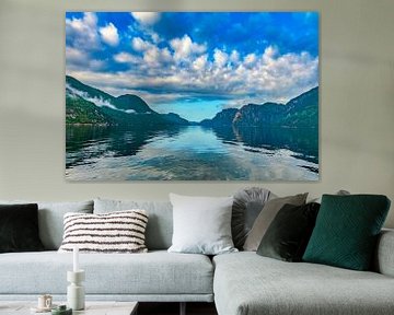 Lysefjord vanaf de ferry met een blauwe wolkenlucht van Henk van Dijk