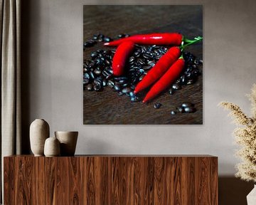 Fresh coffee beans and red hot chilli pepper by Silva Wischeropp