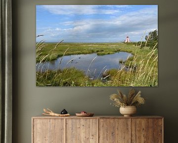 A small lighthouse on the riverbank by Claude Laprise