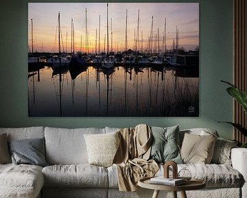 Sailboats in harbour with backlight.