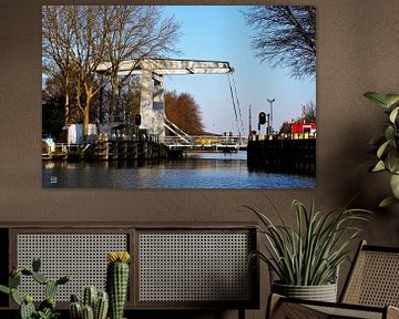 Drawbridge over moat in the Netherlands. by Sailographic Paula