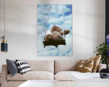 Bear on swing with cloudy blue sky. by Sailographic Paula
