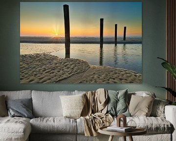 4 piles at sunset near Petten by peterheinspictures