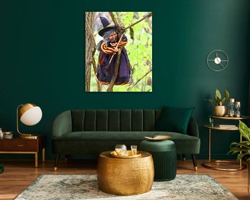 Witch hanging from a branch.