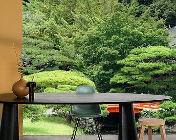 Red japanese bridge in Ritsurin Koen garden by Aagje de Jong