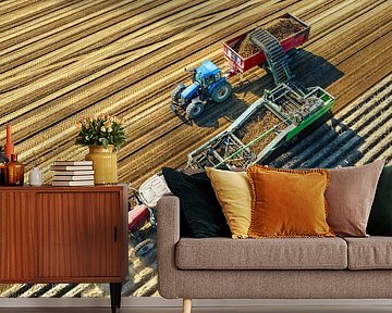 Tractors harvesting potatoes in a field seen from above by Sjoerd van der Wal Photography