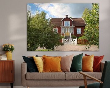 Traditional Swedish red house in Smaland. Surrounded by a red fence. Sweden by Martin Köbsch
