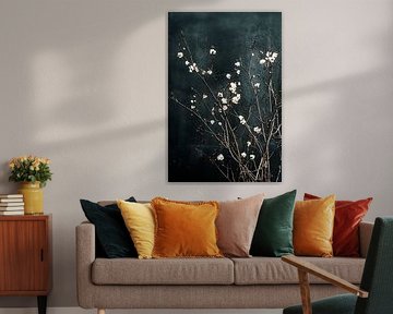 Blossom branches against dark wall