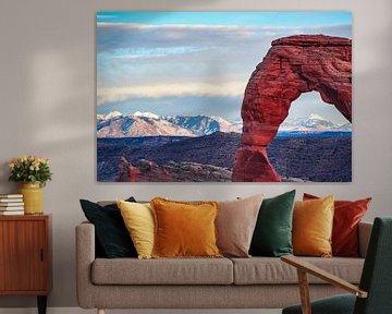The snowy peaks of the Rocky Mountains behind the Delicate Arch by Rietje Bulthuis