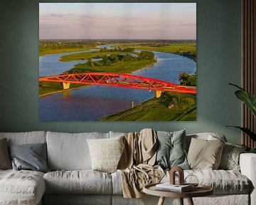 Eisenbahnbrücke in einem farbenfrohen Sonnenuntergang über dem Fluss IJssel von Sjoerd van der Wal Fotografie