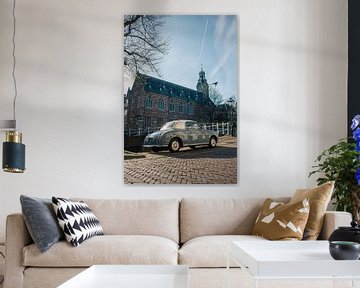 Blue Nissan Figaro on the Rapenburg - vintage charm in historic Leiden by Studio Ajuut