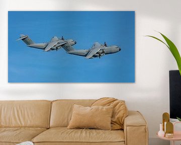 Two Malaysian Airbus A400M transport aircraft.  The Airbus A400M is a military transport aircraft developed by Airbus Military. The first prototype rolled out of the factory on 26 June 2008. The first test flight was conducted on 11 December 2009.  The aircraft was developed by Airbus alongside the Airbus A330 MRTT tanker aircraft and is equipped with turboprop engines. It can land and take off on both paved and unpaved runways.   This picture was taken on 18 May 2025 during LIMA 2025 (Langkawi International Maritime and Aerospace Exhibition).