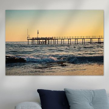 Jetty in sunset by the sea