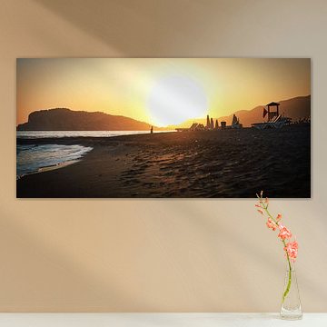 Woman takes selfie during sunset