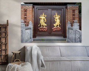 Portal decorated with golden protective divinities by Frank Photos