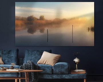 A beautiful sunrise with fog on the Afwateringskanaal in Schildwolde near the Paauwen in the province of Groningen by Marga Vroom
