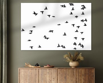 Vol vers la liberté - Étourneaux minimalistes en noir et blanc sur Rob Rollenberg