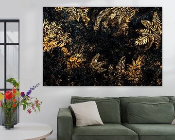 Golden leaves on dark wall