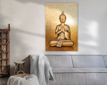 Golden Buddha in front of a shiny background by Alexander Baumann