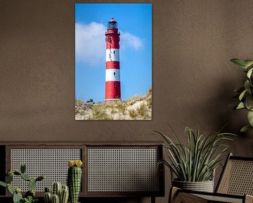 Amrum lighthouse in front of a dune landscape by Alexander Baumann
