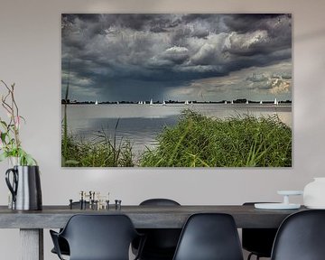 Idsegaasterpoel in Friesland with sailing boats and a threatening cloudy sky by Harrie Muis