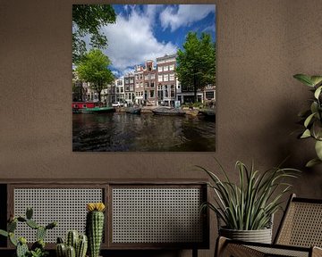 Bridge and canal houses in Amsterdam by Joost Adriaanse