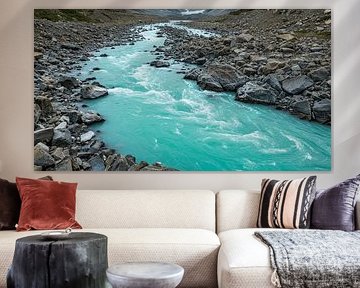 Turquoise-blue glacial river in a rugged rocky landscape by ButterflyPix