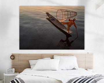 Fisherman shows off his skills on Inle Lake in Myanmar by Anges van der Logt