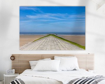 Stone pier on the beach of Blankenberge, Belgium, with a vanishi