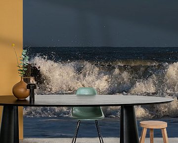 Holiday feeling: Waves splash apart in the light on the breakwaters by Marjolijn van den Berg