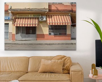 Striped awnings of an Andalusian butcher's shop in Chiclana by Silva Wischeropp