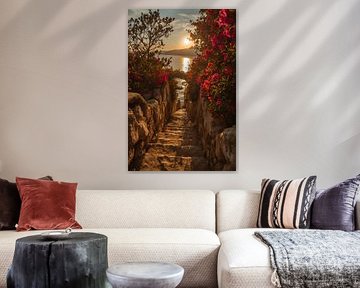 Escalier de pierre fleuri menant à une vue sur la mer au coucher du soleil