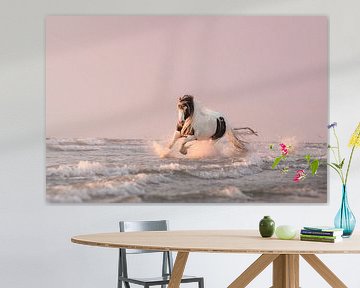 horse running in the rippling sea
