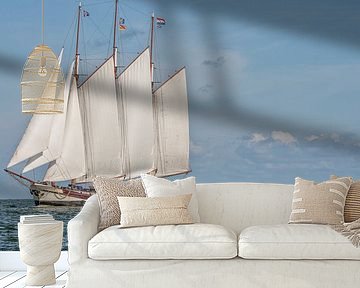 Beautiful large wooden sailboat on the water