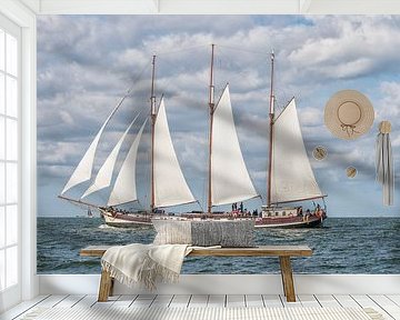   Beautiful large wooden sailboat on the water