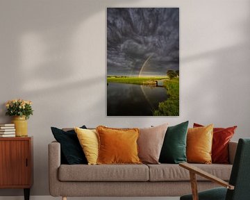 Regenboog boven de polder van Bas Meelker