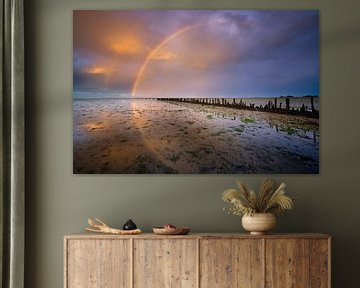 Een regenboog boven de Waddenzee