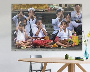 Waving girls during a ceremony at the temple by Anne Ponsen