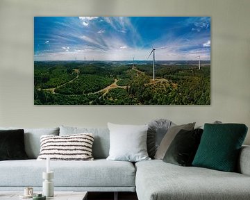 Energy from nature - wind turbine in a green landscape by Conpo Design