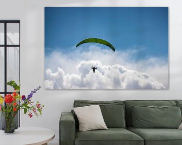 Facing the horizon - parapenter in the clouds by Niels Born