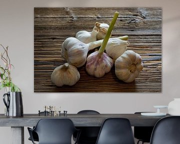 Garlic cloves stylised on weathered wooden boards by Photo Art Thomas Klee