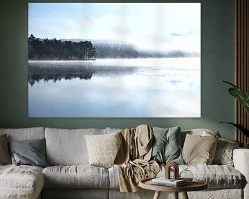Fog rising into the water at dawn on a Swedish lake by Martin Köbsch
